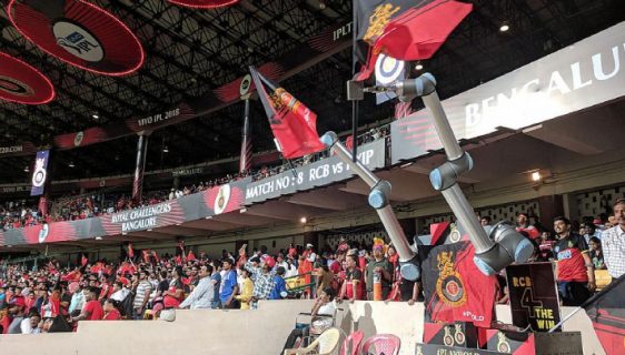 Image Showing The Collaborative Robot Raising The Team Flags and Cheering Like Audience.